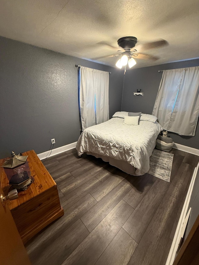 411 Vernon Ave, Morgan, MN 56266 - bedroom with dark wood finished floors, a ceiling fan, and a textured ceiling