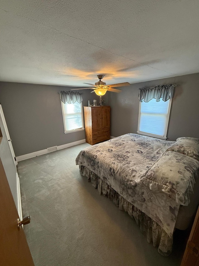411 Vernon Ave, Morgan, MN 56266 - carpeted bedroom with a ceiling fan and baseboards