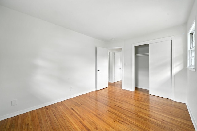 1464 Kent St, Saint Paul, MN 55117 - unfurnished bedroom with light wood-style floors and a closet