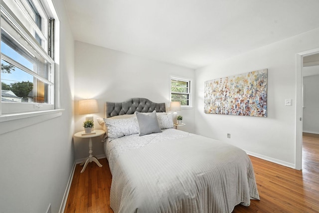 1464 Kent St, Saint Paul, MN 55117 - bedroom featuring baseboards and wood finished floors