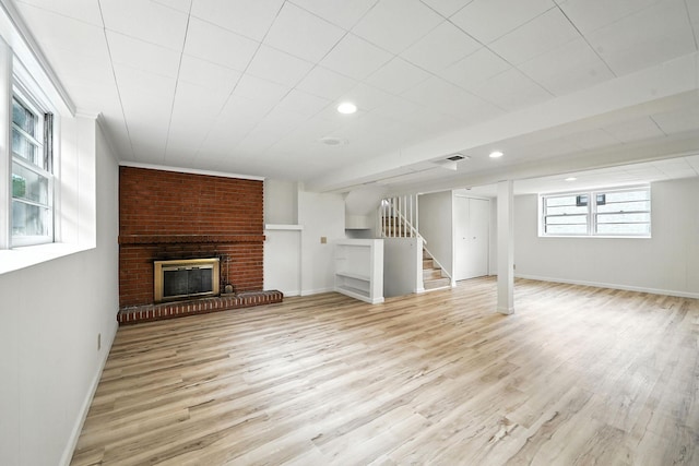 1464 Kent St, Saint Paul, MN 55117 - unfurnished living room featuring stairs, wood finished floors, a brick fireplace, and recessed lighting