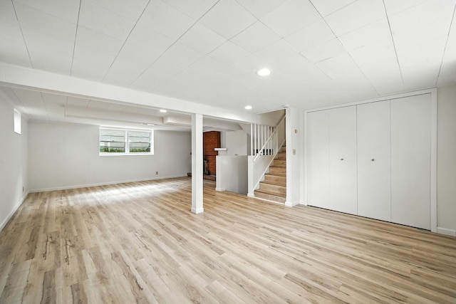 1464 Kent St, Saint Paul, MN 55117 - below grade area featuring light wood-style flooring, stairway, and recessed lighting