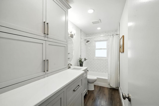 1464 Kent St, Saint Paul, MN 55117 - bathroom with vanity, shower / bath combination with curtain, wood finished floors, and recessed lighting