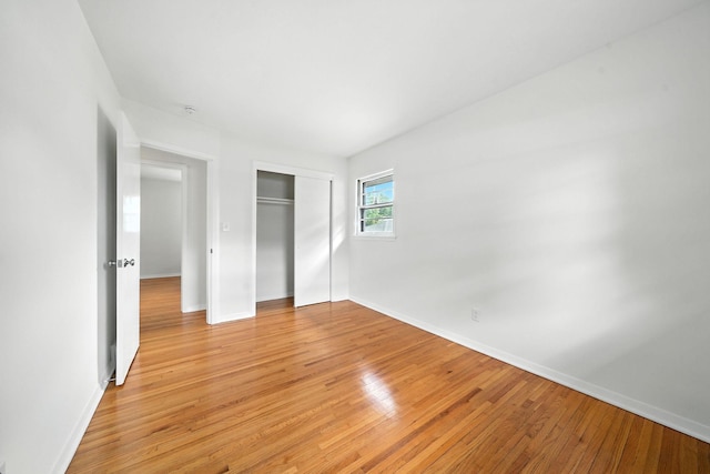 1464 Kent St, Saint Paul, MN 55117 - unfurnished bedroom with light wood-type flooring and a closet