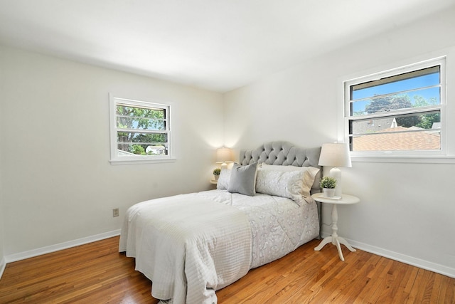 1464 Kent St, Saint Paul, MN 55117 - bedroom with baseboards and wood finished floors