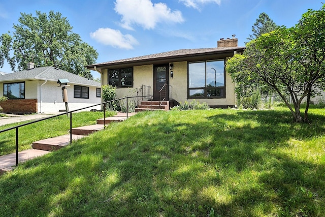 1464 Kent St, Saint Paul, MN 55117 - view of front facade with a chimney, a front lawn, and stucco siding
