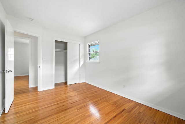 1464 Kent St, Saint Paul, MN 55117 - unfurnished bedroom with light wood-style flooring and a closet