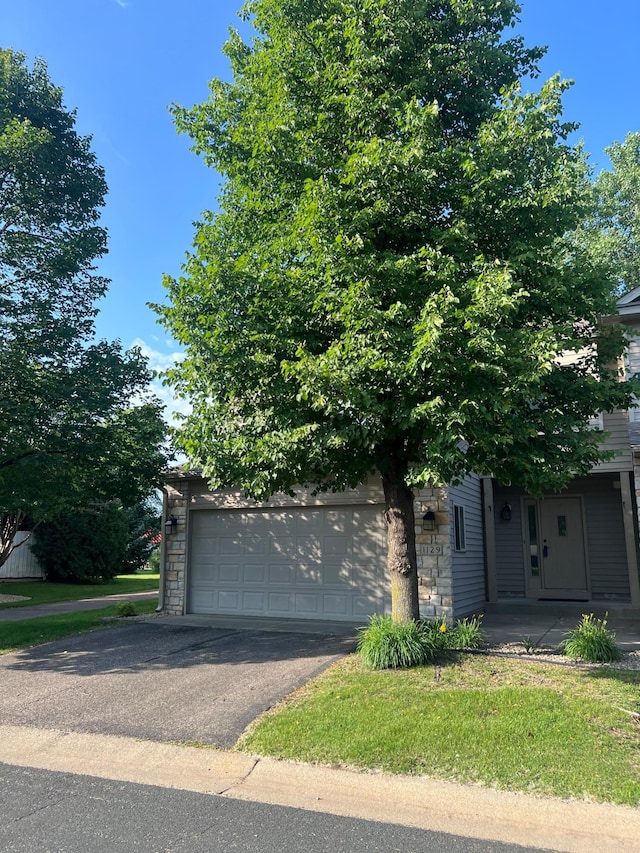 1129 Willow Trl, Farmington, MN 55024 - obstructed view of property with a garage and stone siding