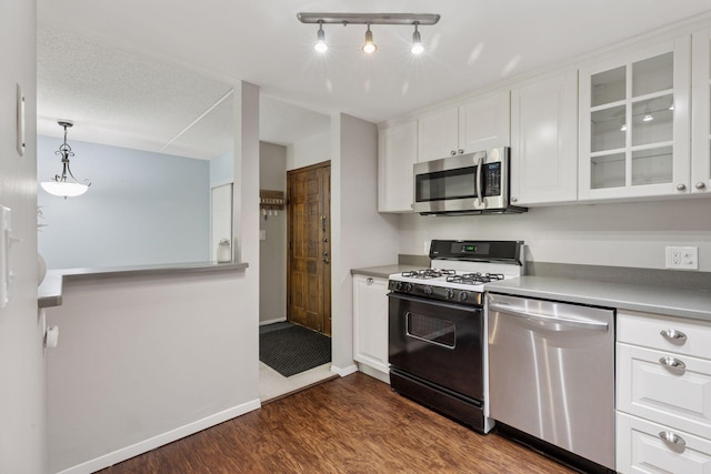6650 Vernon Ave S Unit 111, Edina, MN 55436 - kitchen featuring stainless steel appliances, white cabinetry, dark wood finished floors, glass insert cabinets, and light countertops