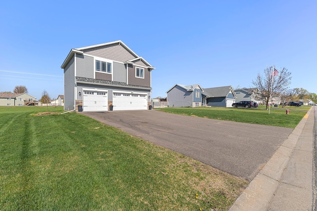 1101 8th Ave SW, Isanti, MN 55040 - view of property exterior featuring an attached garage, asphalt driveway, a yard, and a residential view