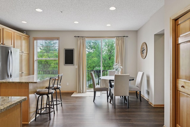 8356 Townsend Dr, Eden Prairie, MN 55344 - dining space featuring plenty of natural light, dark wood-style floors, a textured ceiling, and recessed lighting