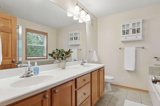 8356 Townsend Dr, Eden Prairie, MN 55344 - bathroom with double vanity, a tub, and tile patterned floors