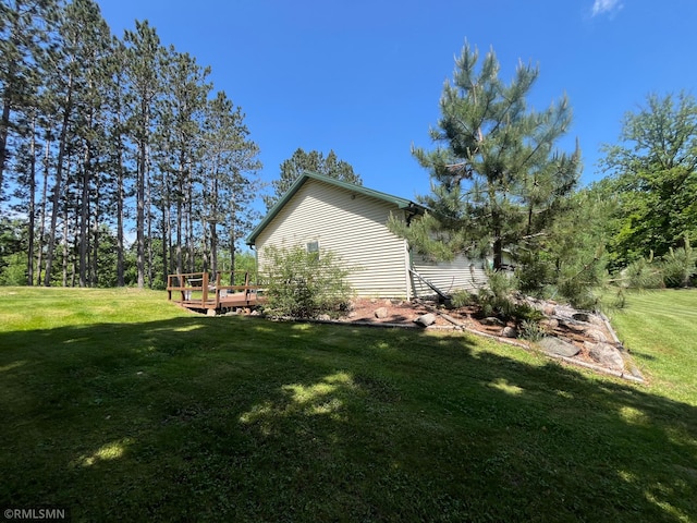37452 Deer St, Aitkin, MN 56431 - view of green lawn with a deck