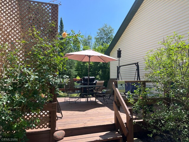 37452 Deer St, Aitkin, MN 56431 - wooden deck with outdoor dining space
