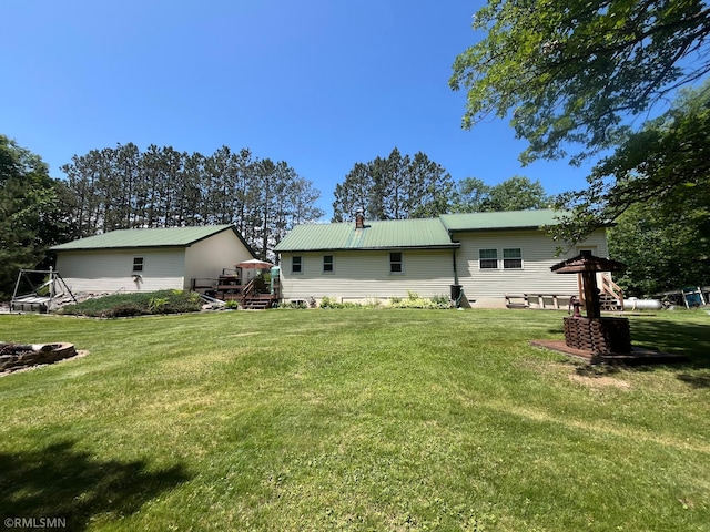 37452 Deer St, Aitkin, MN 56431 - back of property featuring a yard and a metal roof