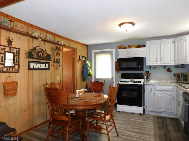 37452 Deer St, Aitkin, MN 56431 - dining space featuring light wood finished floors and wood walls
