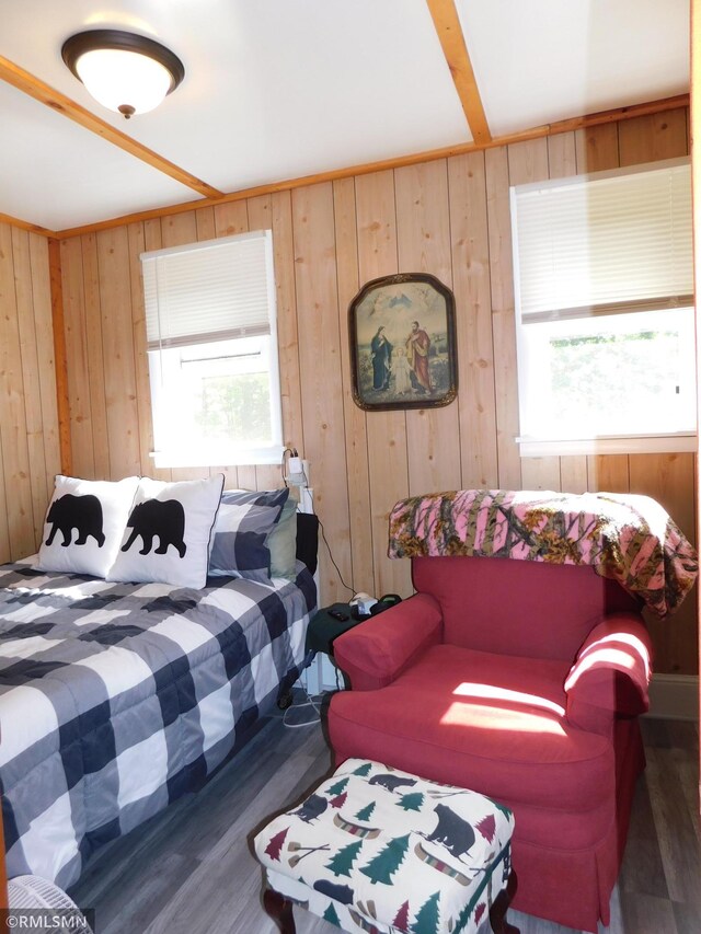 37452 Deer St, Aitkin, MN 56431 - bedroom featuring wood finished floors, multiple windows, and wood walls