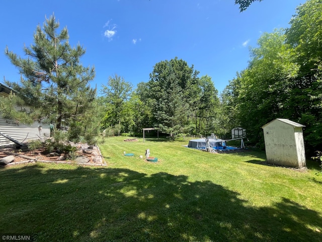 37452 Deer St, Aitkin, MN 56431 - view of grassy yard with a storage unit