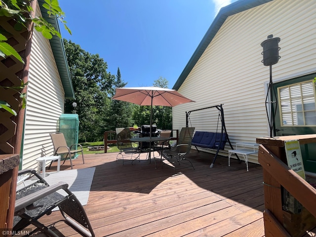37452 Deer St, Aitkin, MN 56431 - wooden terrace with outdoor dining area