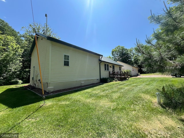 37452 Deer St, Aitkin, MN 56431 - view of home's exterior with a yard and a deck