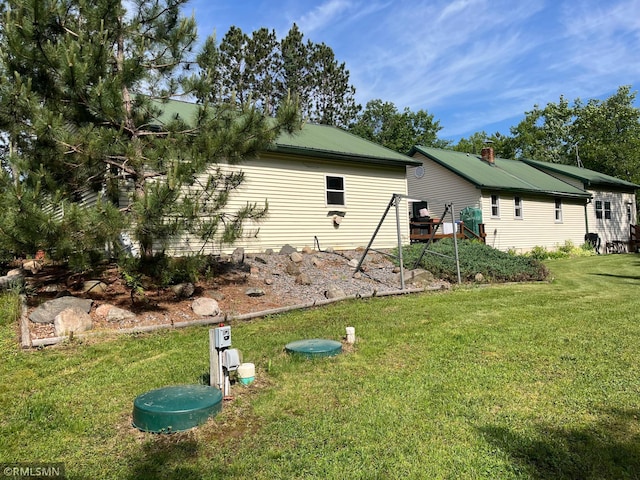 37452 Deer St, Aitkin, MN 56431 - view of property exterior with a yard and a metal roof