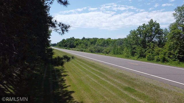 37452 Deer St, Aitkin, MN 56431 - view of asphalt road featuring a forest view