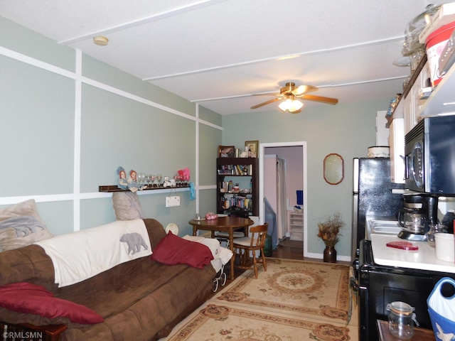 37452 Deer St, Aitkin, MN 56431 - living room with ceiling fan and wood finished floors