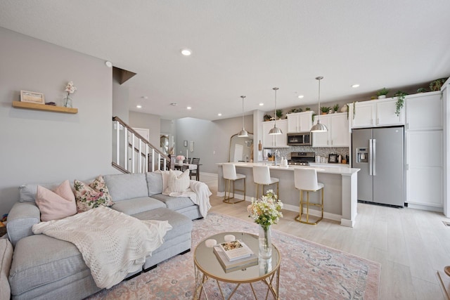 18874 72nd Pl N, Maple Grove, MN 55311 - living room with stairs, light wood-type flooring, and recessed lighting