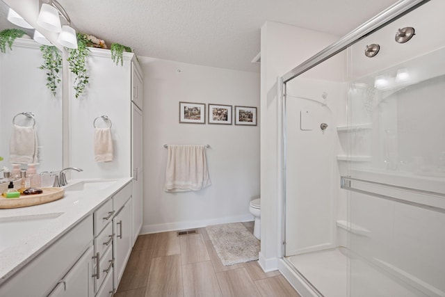 18874 72nd Pl N, Maple Grove, MN 55311 - full bath featuring a stall shower, double vanity, and a textured ceiling