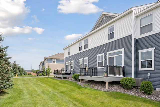 18874 72nd Pl N, Maple Grove, MN 55311 - rear view of property featuring a deck and a lawn