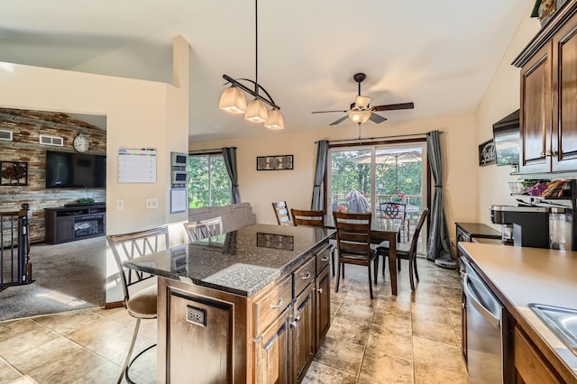 40224 Golden Way, North Branch, MN 55056 - kitchen featuring dishwasher, vaulted ceiling, a ceiling fan, a breakfast bar, and plenty of natural light
