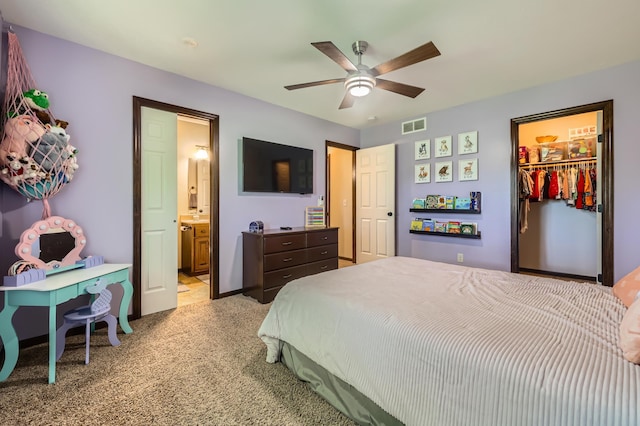 40224 Golden Way, North Branch, MN 55056 - bedroom with light colored carpet, ensuite bath, a spacious closet, a closet, and ceiling fan