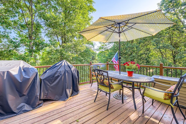 40224 Golden Way, North Branch, MN 55056 - wooden deck featuring outdoor dining space and area for grilling