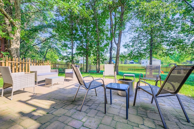 40224 Golden Way, North Branch, MN 55056 - fenced backyard featuring a patio and an outdoor fire pit