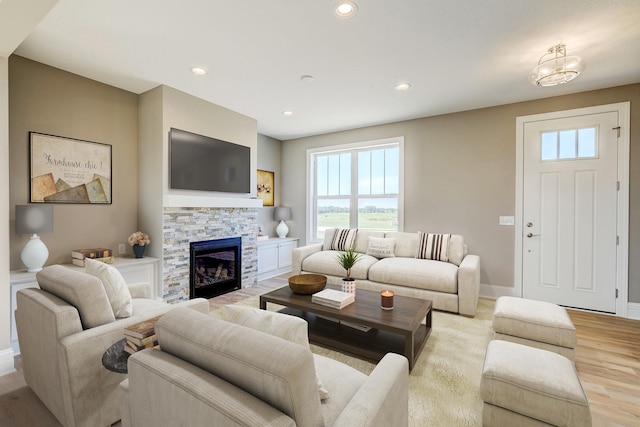 2885 Trinity Dr, Shakopee, MN 55379 - living room with light wood-style floors, plenty of natural light, a stone fireplace, and recessed lighting