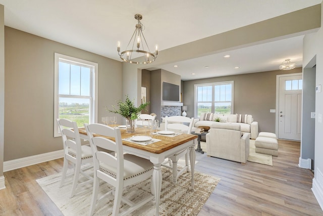 2885 Trinity Dr, Shakopee, MN 55379 - dining area with a chandelier, light wood-style flooring, and recessed lighting