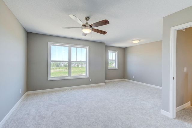 2885 Trinity Dr, Shakopee, MN 55379 - empty room featuring light colored carpet, a ceiling fan, and a textured ceiling