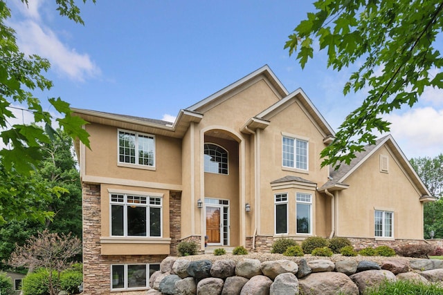 15208 Fairway Heights Rd NW, Prior Lake, MN 55372 - traditional-style home featuring stucco siding and stone siding