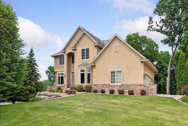 15208 Fairway Heights Rd NW, Prior Lake, MN 55372 - traditional home featuring stucco siding, stone siding, and a front yard