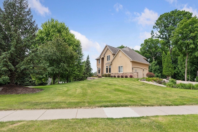 15208 Fairway Heights Rd NW, Prior Lake, MN 55372 - view of front facade featuring stucco siding, stone siding, an attached garage, and a front lawn