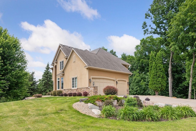 15208 Fairway Heights Rd NW, Prior Lake, MN 55372 - view of side of property featuring stucco siding, stone siding, a garage, a yard, and driveway