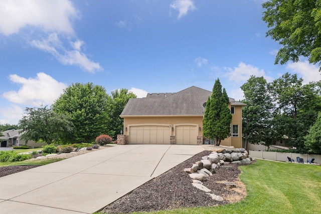 15208 Fairway Heights Rd NW, Prior Lake, MN 55372 - view of front facade featuring a garage, driveway, stone siding, and stucco siding