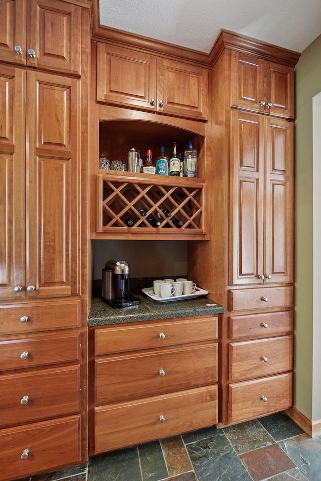 15208 Fairway Heights Rd NW, Prior Lake, MN 55372 - bar featuring dark stone finish floors and baseboards