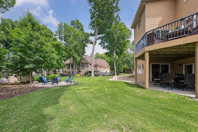 15208 Fairway Heights Rd NW, Prior Lake, MN 55372 - view of grassy yard with a fire pit, a patio, stairway, and a deck