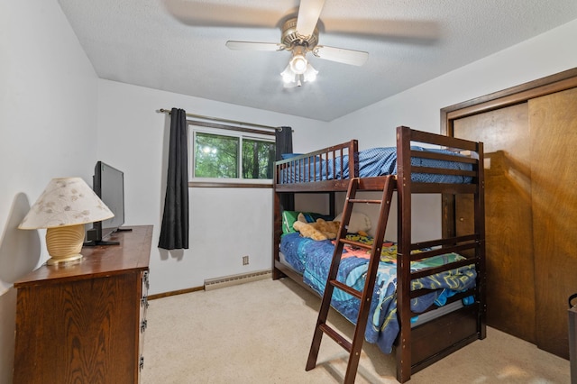 5510 Thompson Hill Rd, Proctor, MN 55810 - bedroom featuring a baseboard heating unit, carpet floors, a ceiling fan, and a textured ceiling