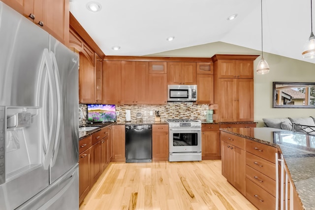 4619 Heather Way N, Oakdale, MN 55128 - kitchen featuring stainless steel appliances, light wood-type flooring, brown cabinets, lofted ceiling, and recessed lighting