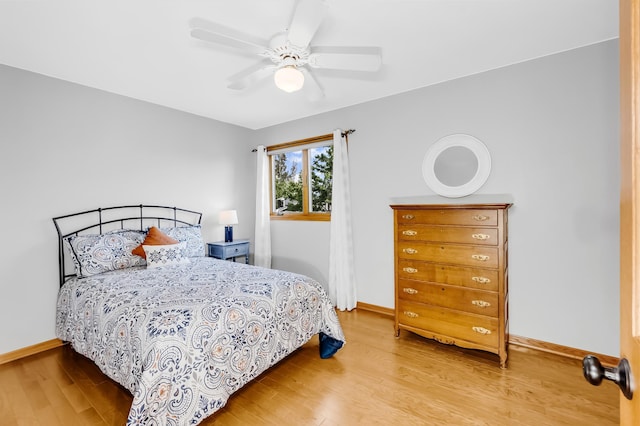 4619 Heather Way N, Oakdale, MN 55128 - bedroom featuring wood finished floors and ceiling fan