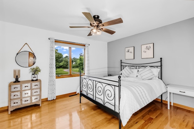 4619 Heather Way N, Oakdale, MN 55128 - bedroom with light wood-type flooring and ceiling fan