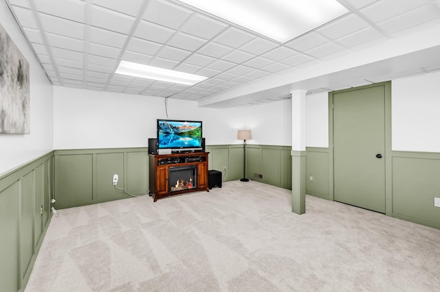 4619 Heather Way N, Oakdale, MN 55128 - finished basement featuring wainscoting, light carpet, and a decorative wall