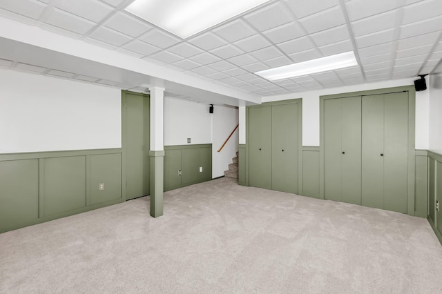 4619 Heather Way N, Oakdale, MN 55128 - finished basement featuring a wainscoted wall, stairs, and carpet floors